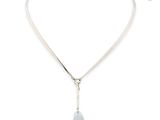 a close up of a necklace on a white background