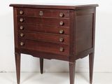 an old wooden chest of drawers with three drawers on one side and two drawers on the other