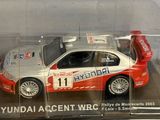 a white and red car in a clear box
