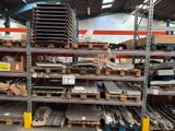a large amount of metal items on the shelves in the warehouse