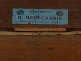 a blue sign on a piece of wood that says h montchain