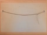 an old picture of a piece of paper with a string attached to it