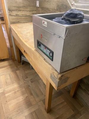 a machine that is sitting on top of a wooden table