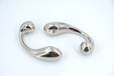 pair of silver plated cuff bracelets on white background