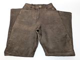 an old pair of brown pants sitting on top of a white surface