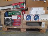 a pile of boxes on a pallet next to a television