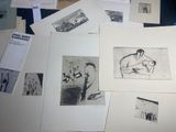 several black and white pictures of a woman and a child on a table