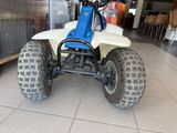 an image of a four wheeler atv parked in a garage