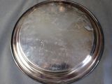 a silver plate that is sitting on a table