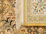 a close up of a rug with a picture of a bird on it