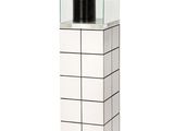 an image of a glass display case with a black cylinder in it