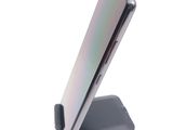 a close up of a cell phone on a stand