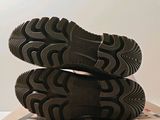 a pair of shoes that are on top of a box