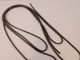 a pair of black leather leashes laying on a white surface