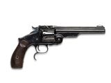 gros plan d'un revolver sur fond blanc