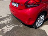 a red car that is parked in a parking lot