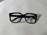 the glasses are black and have clear lenses on them