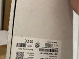 a person holding a box with a barcode on it