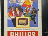 philips radio advertisement on a wall in a subway station