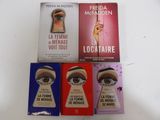 three books on a table with a keyhole in the middle of them
