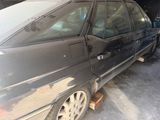 a car that is parked in a garage with the door open
