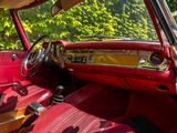 a red car with a red leather seat and dashboard