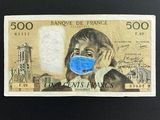 a drawing of a woman wearing a face mask on a bank note