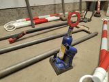 a red and white pipe clamp and a blue pipe clamp on the ground