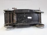 a small model of a train on a white surface