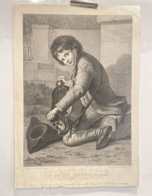 an old picture of a man kneeling down with a hat on his knee