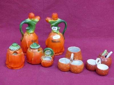 a group of orange and green vases with pumpkins on them