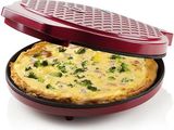 a pizza in a pan with broccoli on it