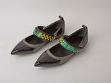 pair of women ' s black shoes with yellow and green trims