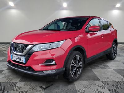 a red nissan qx - v parked on a checkered floor