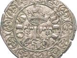 a close up of a silver coin with a design on it