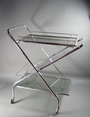 an image of a chrome and glass bar cart