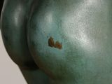 a close up of a statue of a woman ' s butt