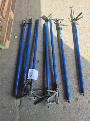 several tools are laid out on the floor next to a pallet