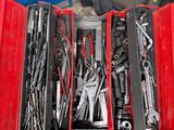 many tools in a red box on the ground
