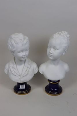 pair of porcelain busts of a boy and a girl