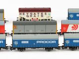 a lot of toy trains that are lined up on the tracks