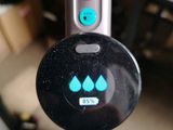 a close up of a device with a button on it