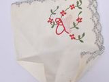 an image of a piece of cloth with a heart and flowers on it