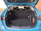 a trunk of a car with luggage in it