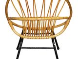an image of a wicker chair with a black metal frame