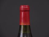 a bottle of wine that is sitting on a table