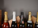several bottles of wine are lined up on a table