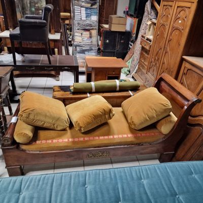 a couch that has pillows on it in a room