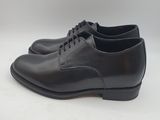 a pair of black leather shoes on a white background