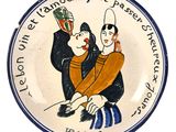 une assiette sur laquelle est représentée une image de deux personnes